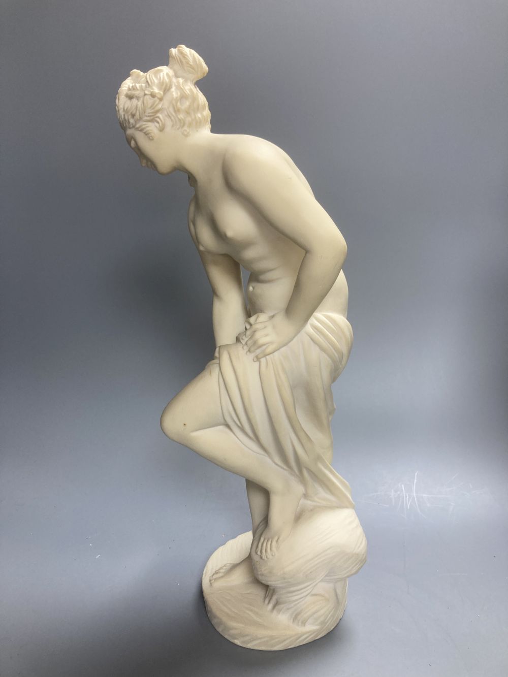 A Copeland Parian figure of a winged maiden and a later composition figure of Venus bathing, H 43cm
